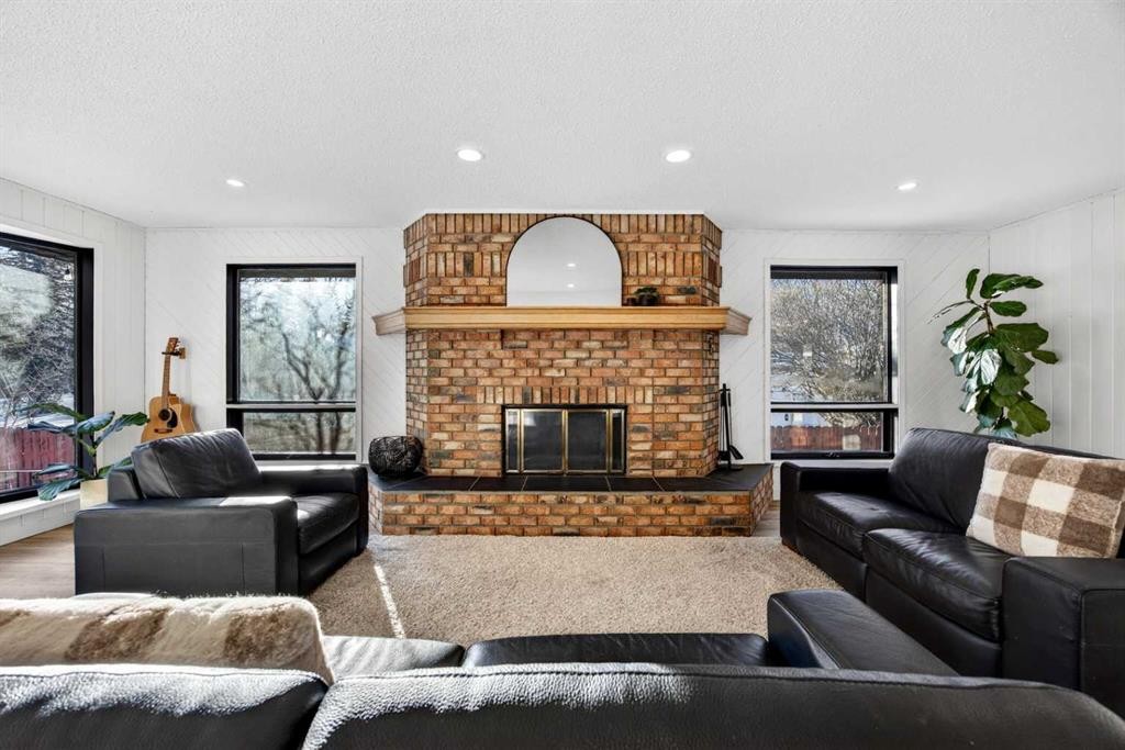 7103 Bow Crescent Nw, Calgary, AB - Indoor Photo Showing Living Room With Fireplace
