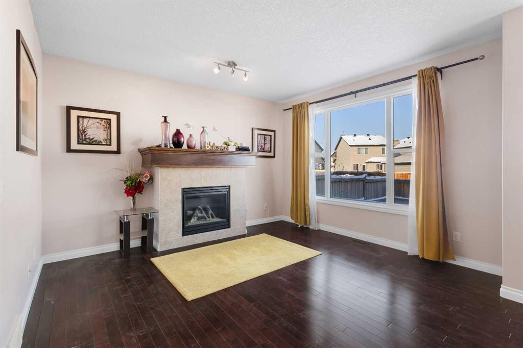 529 Saddlelake Drive Ne, Calgary, AB - Indoor Photo Showing Living Room With Fireplace