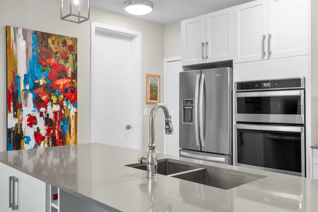607-11 Mahogany Circle Se, Calgary, AB - Indoor Photo Showing Kitchen With Double Sink With Upgraded Kitchen