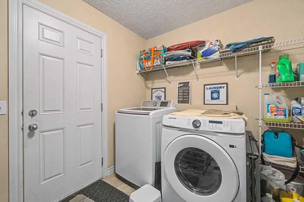 284 Hawkmere View, Chestermere, AB - Indoor Photo Showing Laundry Room
