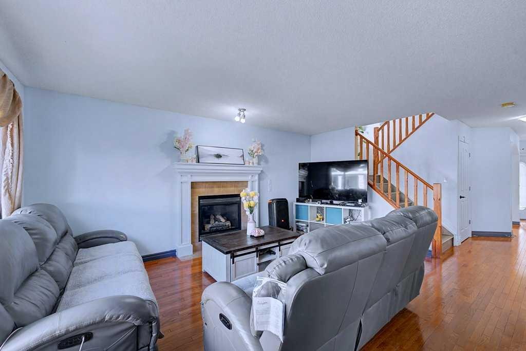284 Hawkmere View, Chestermere, AB - Indoor Photo Showing Living Room With Fireplace