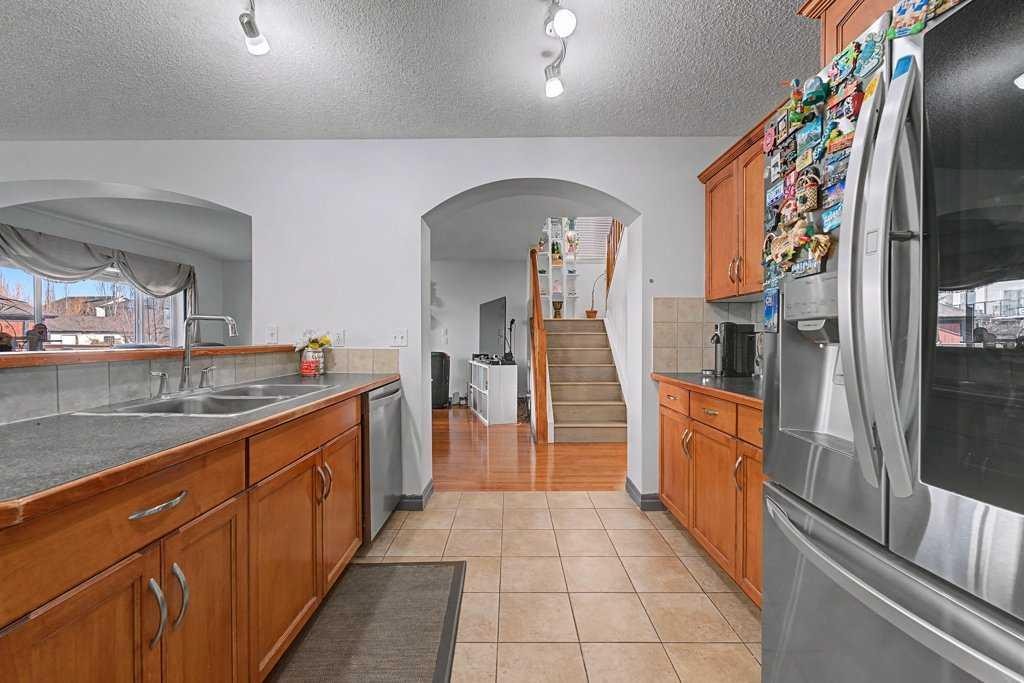 284 Hawkmere View, Chestermere, AB - Indoor Photo Showing Kitchen With Double Sink