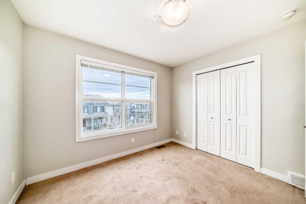 58-138 Seton Passage Se, Calgary, AB - Indoor Photo Showing Other Room