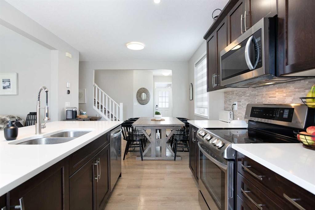 2 Osborne Common Sw, Airdrie, AB - Indoor Photo Showing Kitchen With Double Sink