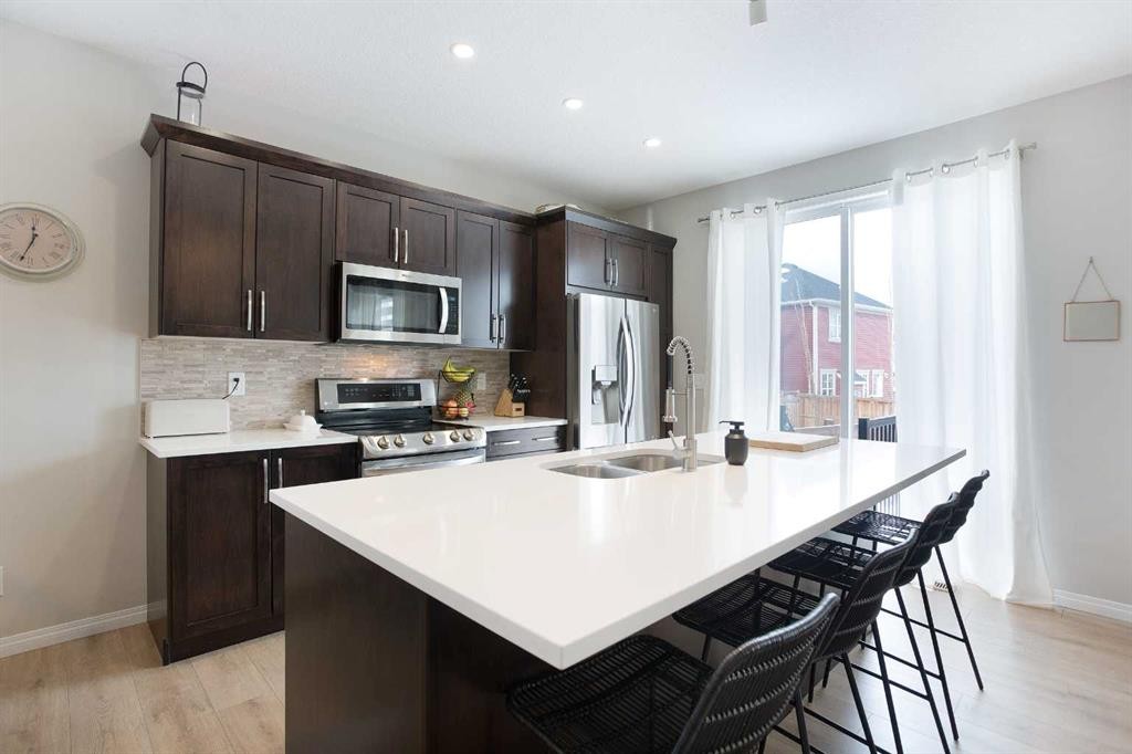 2 Osborne Common Sw, Airdrie, AB - Indoor Photo Showing Kitchen With Double Sink