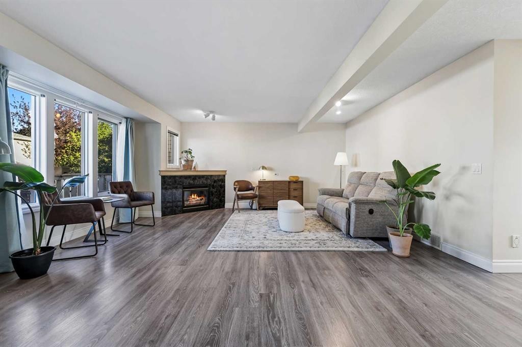 392 Killarney Glen Court Sw, Calgary, AB - Indoor Photo Showing Living Room With Fireplace
