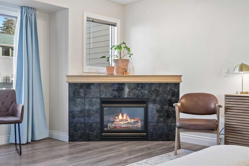 392 Killarney Glen Court Sw, Calgary, AB - Indoor Photo Showing Other Room With Fireplace