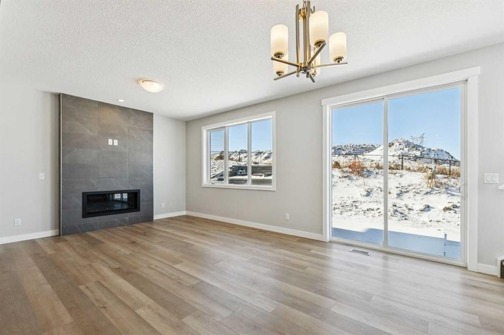 12 Willow Park Point, Cochrane, AB - Indoor Photo Showing Living Room With Fireplace
