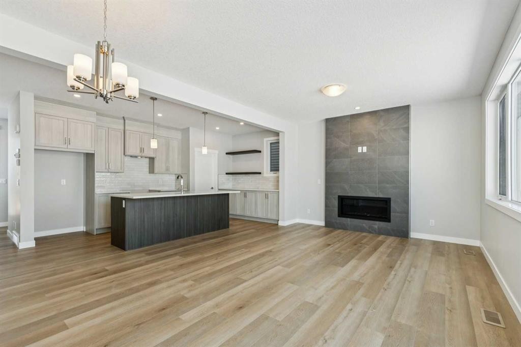 12 Willow Park Point, Cochrane, AB - Indoor With Fireplace