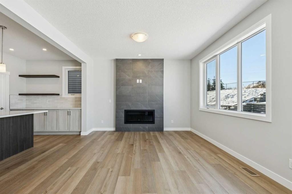 12 Willow Park Point, Cochrane, AB - Indoor With Fireplace