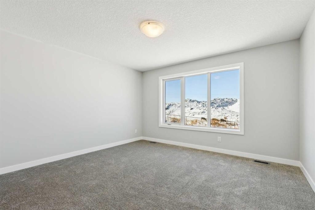 12 Willow Park Point, Cochrane, AB - Indoor Photo Showing Other Room