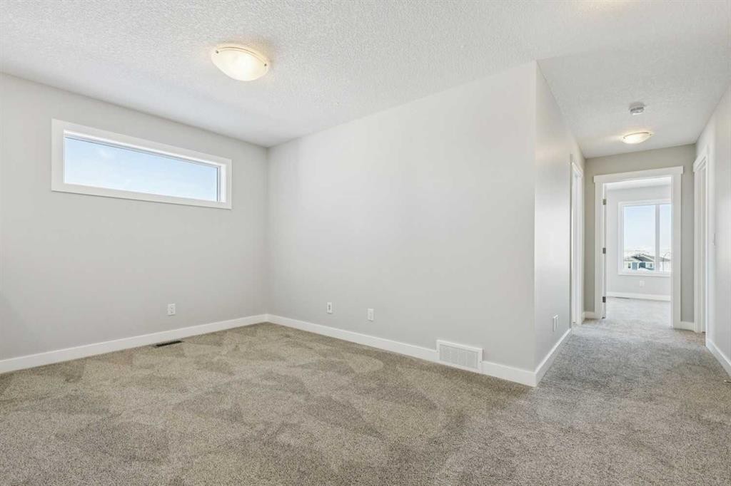 12 Willow Park Point, Cochrane, AB - Indoor Photo Showing Other Room