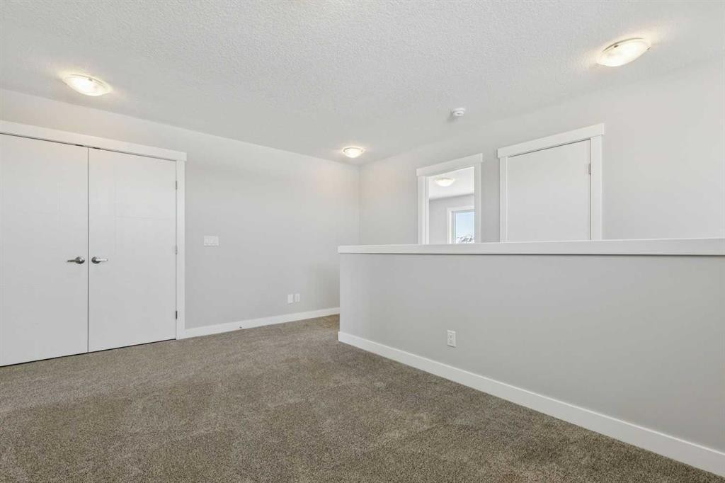 12 Willow Park Point, Cochrane, AB - Indoor Photo Showing Other Room