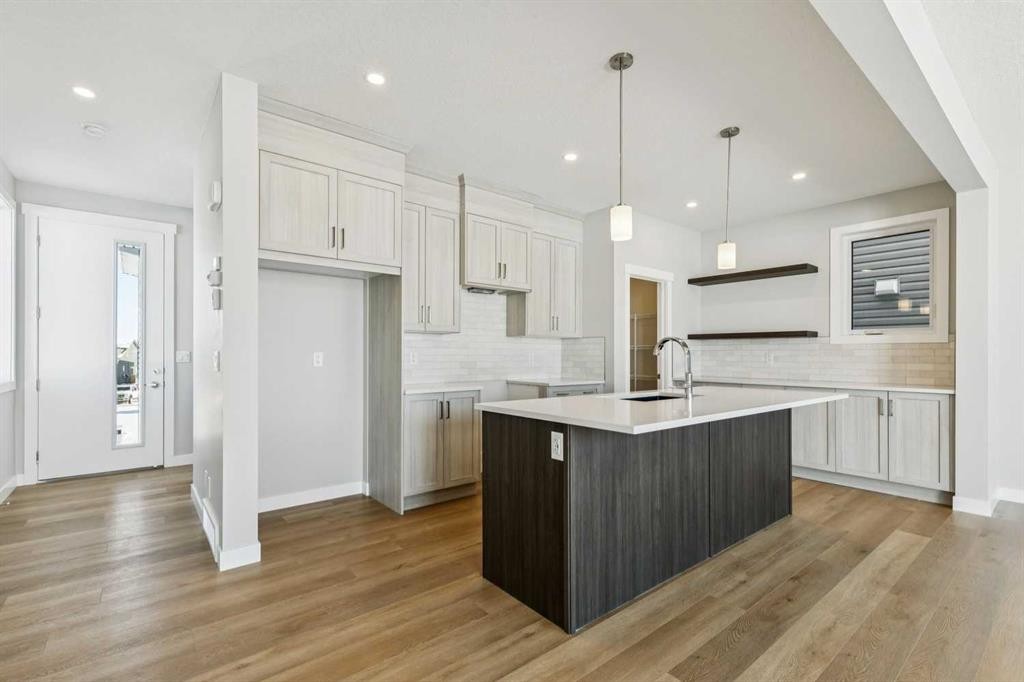 12 Willow Park Point, Cochrane, AB - Indoor Photo Showing Kitchen With Upgraded Kitchen