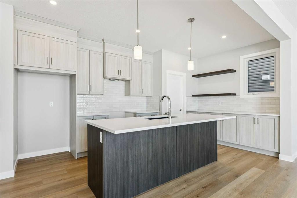 12 Willow Park Point, Cochrane, AB - Indoor Photo Showing Kitchen With Upgraded Kitchen