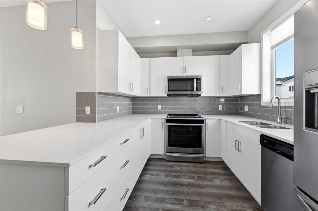 125-301 Redstone Boulevard Ne, Calgary, AB - Indoor Photo Showing Kitchen With Double Sink With Upgraded Kitchen
