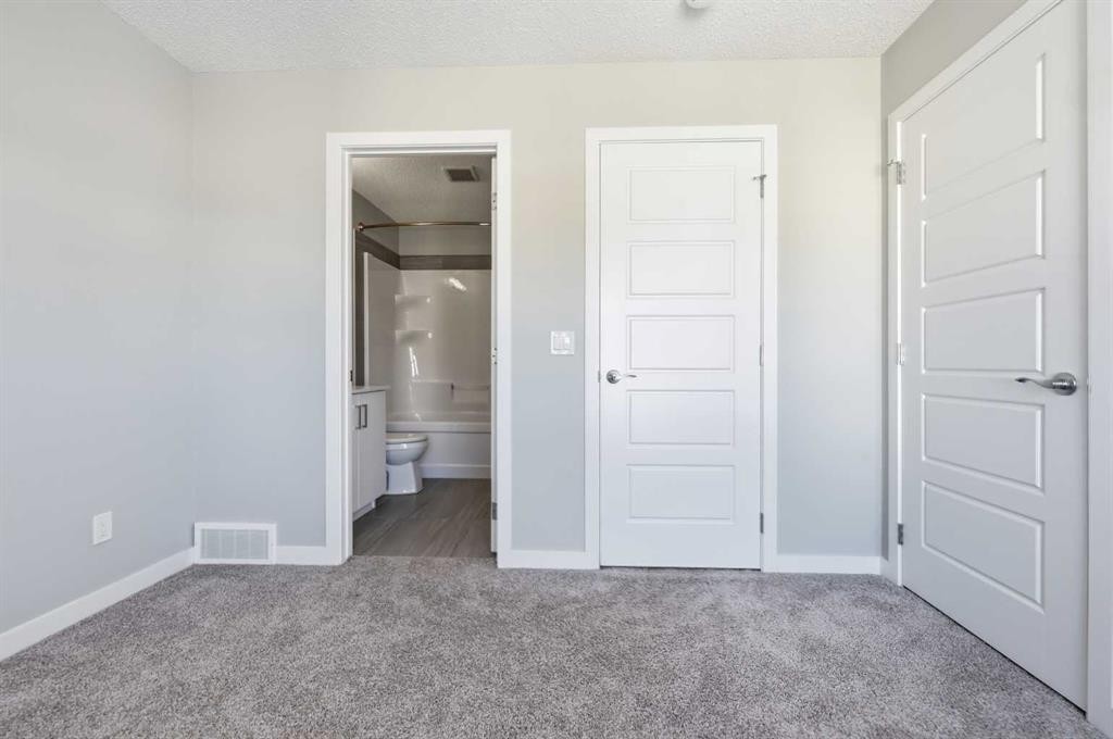 125-301 Redstone Boulevard Ne, Calgary, AB - Indoor Photo Showing Other Room