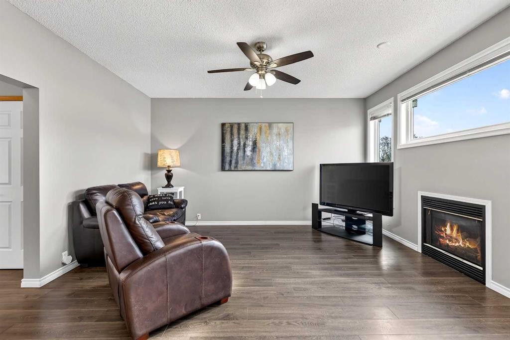 1153 Prestwick Circle Se, Calgary, AB - Indoor Photo Showing Living Room With Fireplace