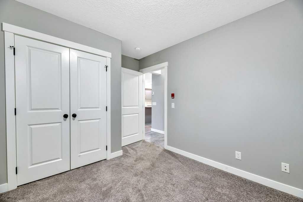 12-606 Lakeside Boulevard, Strathmore, AB - Indoor Photo Showing Other Room