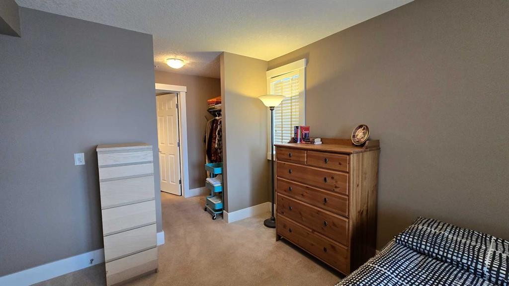 128-500 Rocky Vista Gardens Nw, Calgary, AB - Indoor Photo Showing Bedroom