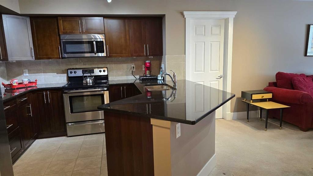 128-500 Rocky Vista Gardens Nw, Calgary, AB - Indoor Photo Showing Kitchen With Stainless Steel Kitchen