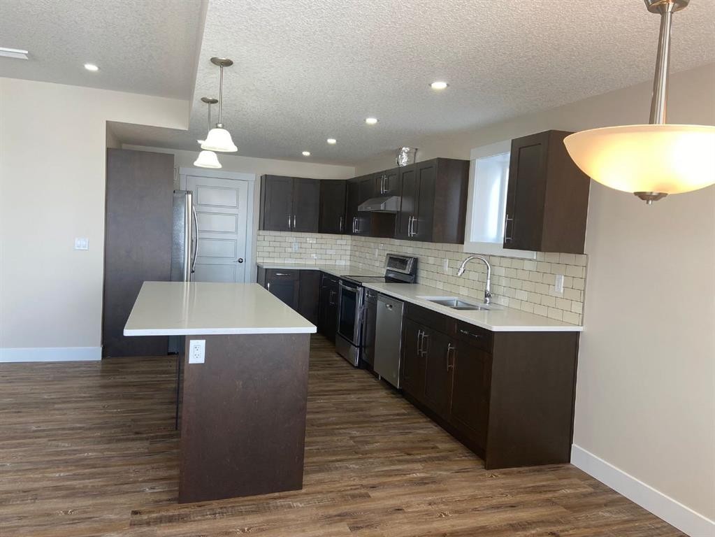 125 Westview Drive, Nanton, AB - Indoor Photo Showing Kitchen