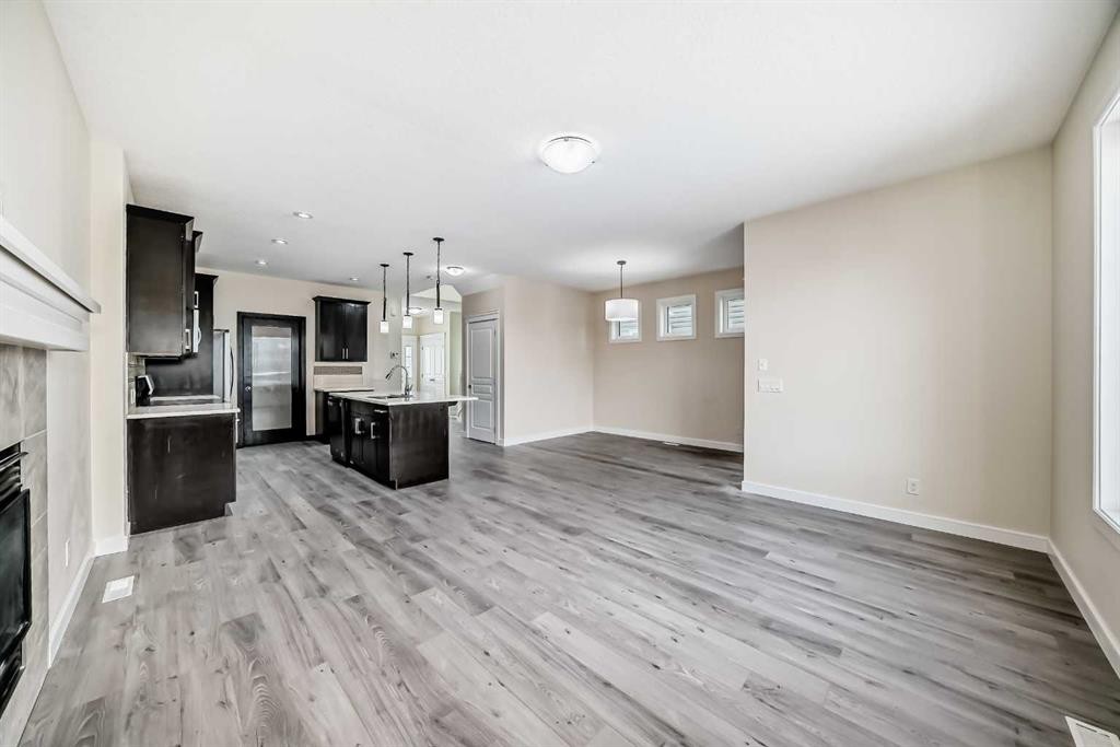 437 Redstone Grove Ne, Calgary, AB - Indoor Photo Showing Other Room With Fireplace