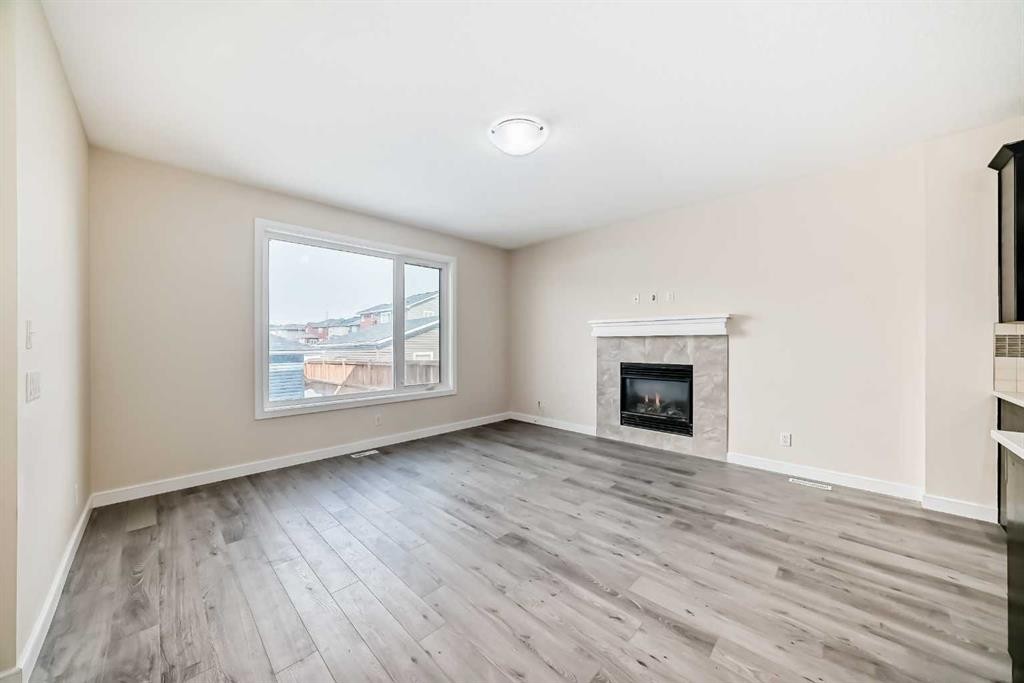 437 Redstone Grove Ne, Calgary, AB - Indoor Photo Showing Living Room With Fireplace