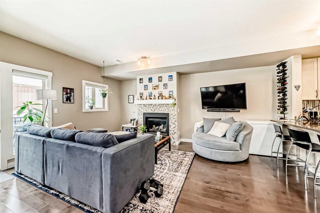 106 Cougar Ridge Landing Sw, Calgary, AB - Indoor Photo Showing Living Room With Fireplace