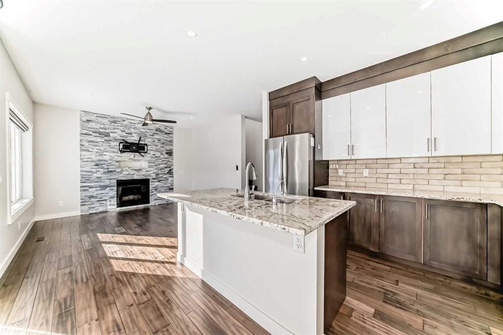 9 Saddlecrest Crescent Ne, Calgary, AB - Indoor Photo Showing Kitchen With Fireplace With Upgraded Kitchen