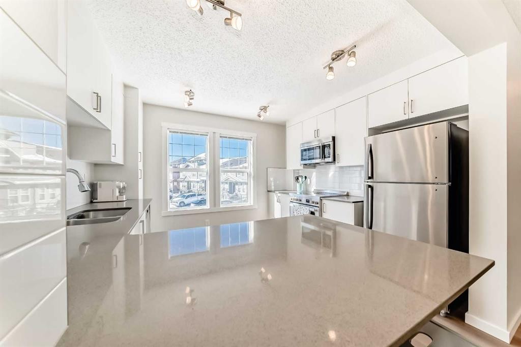 272 Cranbrook Square Se, Calgary, AB - Indoor Photo Showing Kitchen With Stainless Steel Kitchen With Double Sink With Upgraded Kitchen
