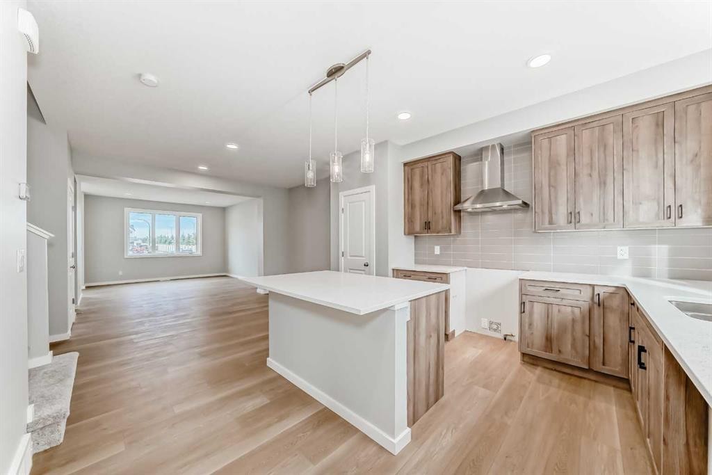 85 Starling Boulevard Nw, Calgary, AB - Indoor Photo Showing Kitchen With Upgraded Kitchen