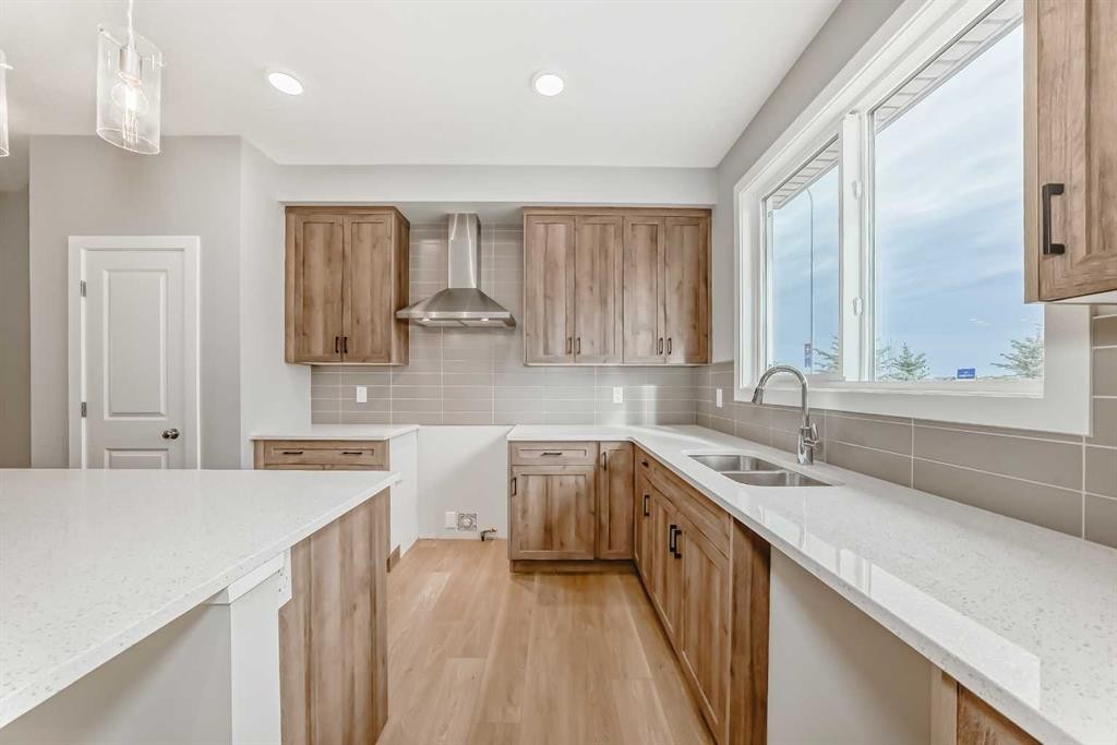 85 Starling Boulevard Nw, Calgary, AB - Indoor Photo Showing Kitchen With Double Sink