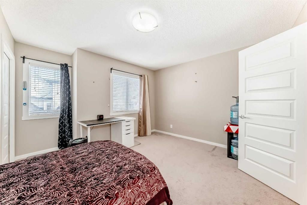 38 Auburn Bay Link Se, Calgary, AB - Indoor Photo Showing Bedroom