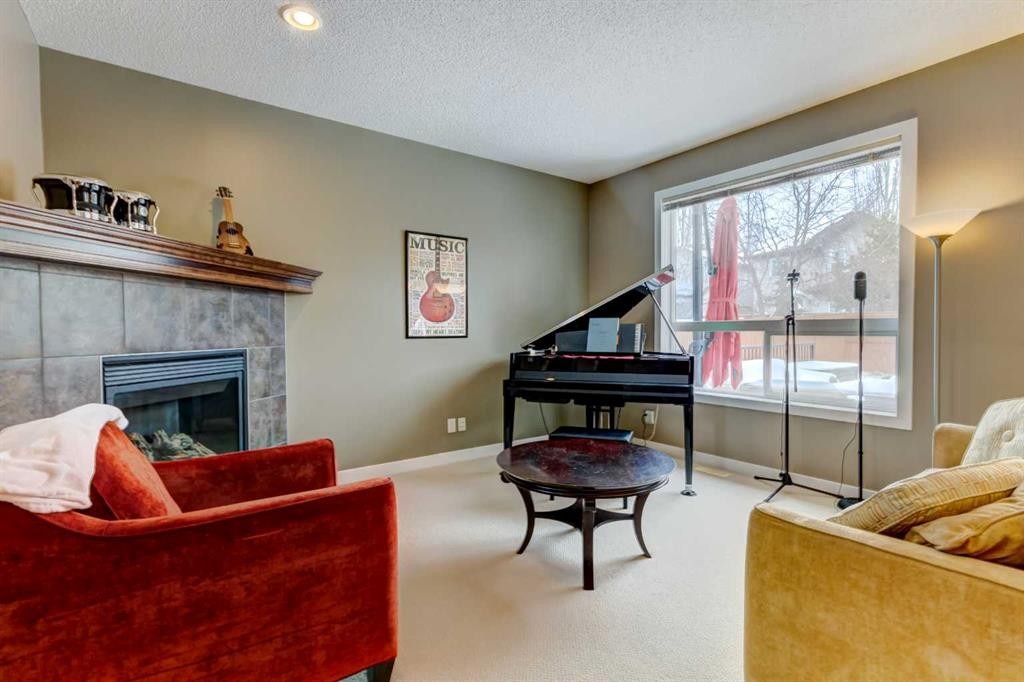185 Brightonstone Landing Se, Calgary, AB - Indoor Photo Showing Living Room With Fireplace