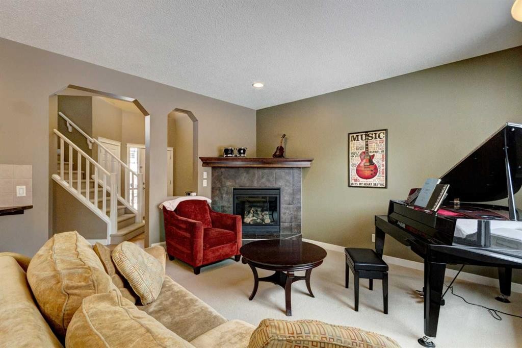 185 Brightonstone Landing Se, Calgary, AB - Indoor Photo Showing Living Room With Fireplace