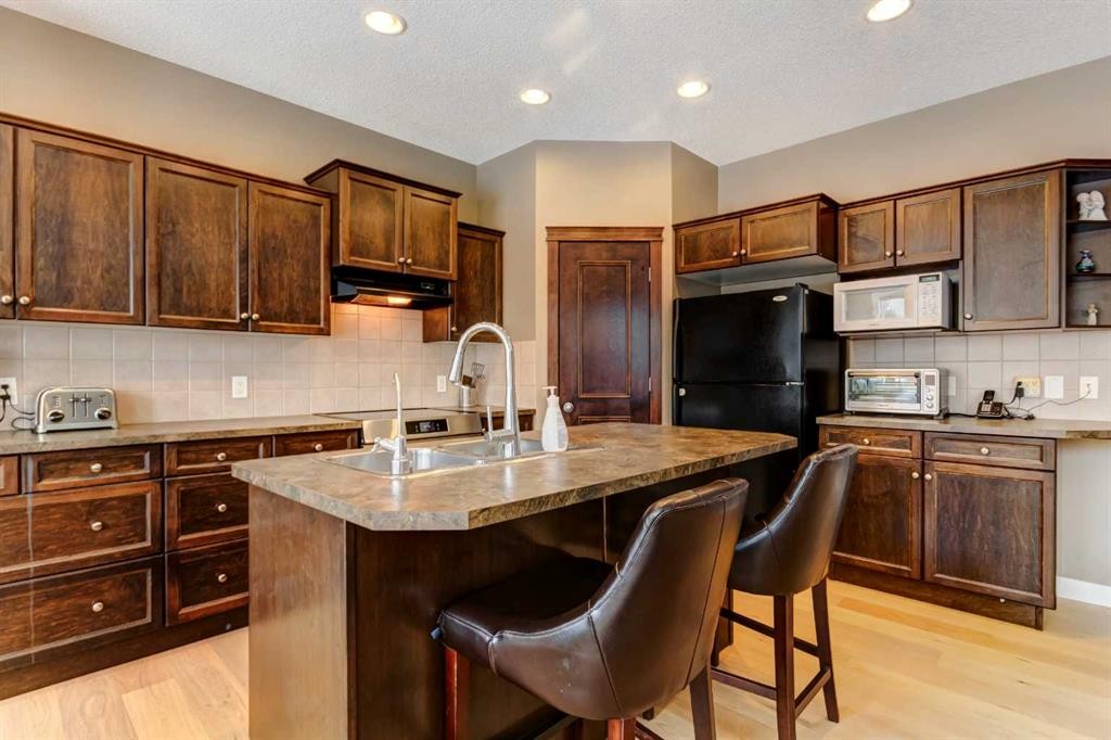 185 Brightonstone Landing Se, Calgary, AB - Indoor Photo Showing Kitchen With Double Sink