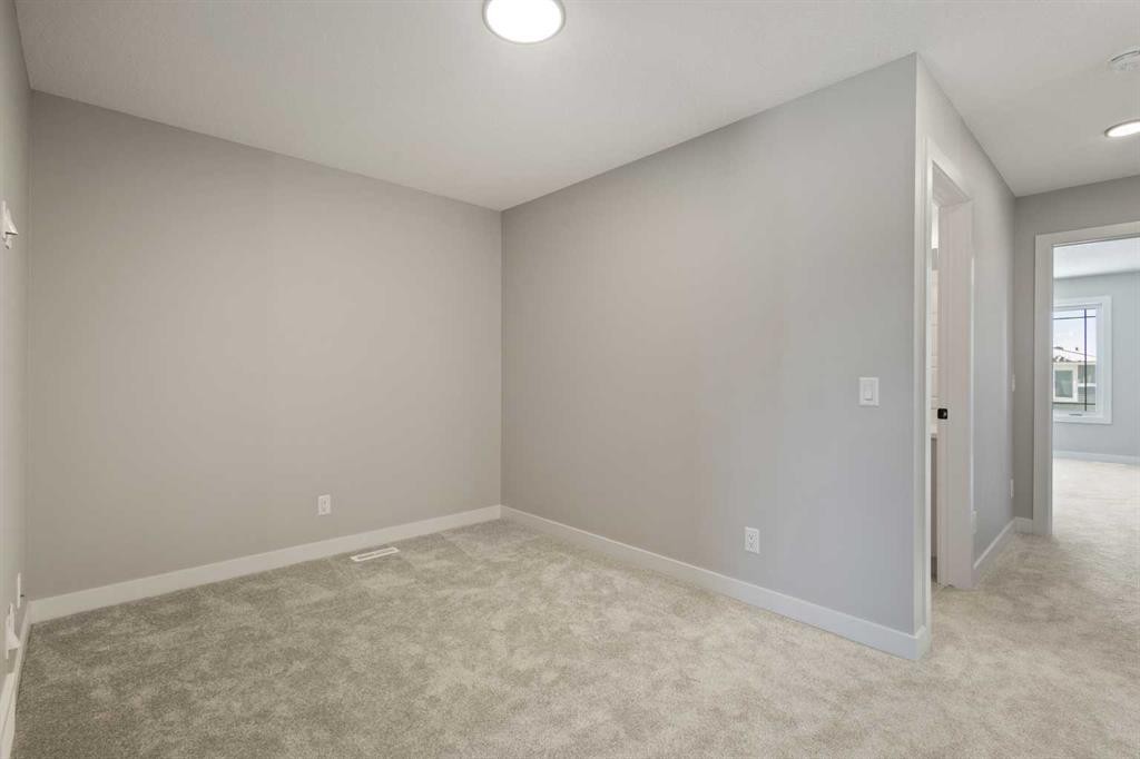 65 Amblefield Heights Nw, Calgary, AB - Indoor Photo Showing Other Room