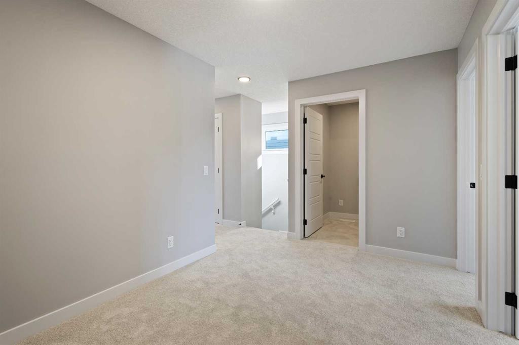 65 Amblefield Heights Nw, Calgary, AB - Indoor Photo Showing Other Room