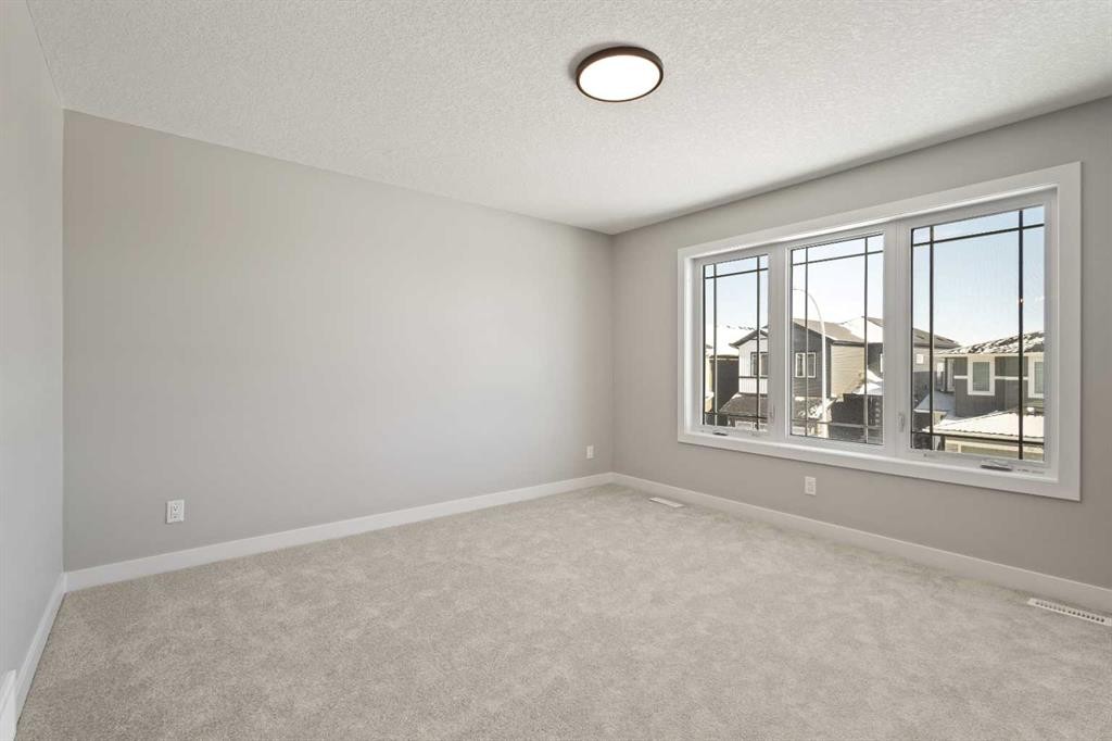 65 Amblefield Heights Nw, Calgary, AB - Indoor Photo Showing Other Room