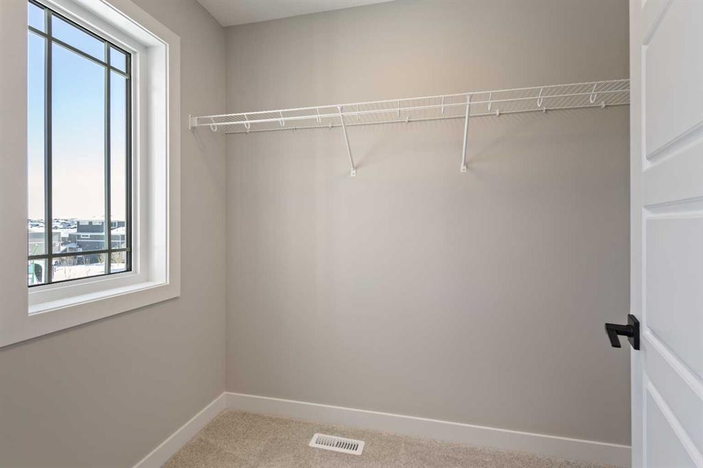 65 Amblefield Heights Nw, Calgary, AB - Indoor With Storage