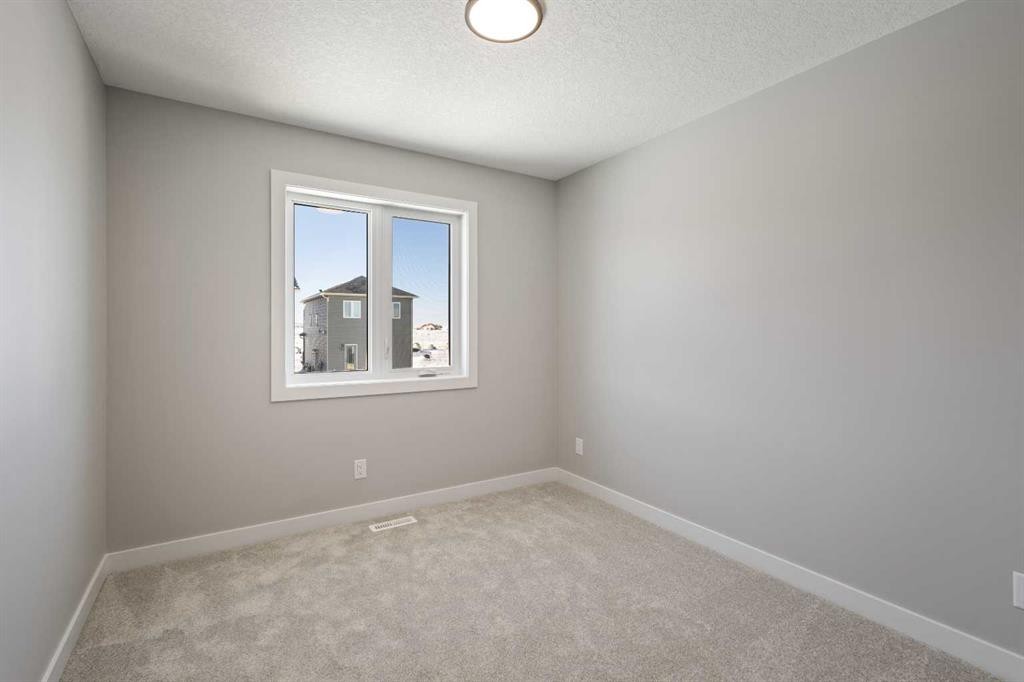 65 Amblefield Heights Nw, Calgary, AB - Indoor Photo Showing Other Room