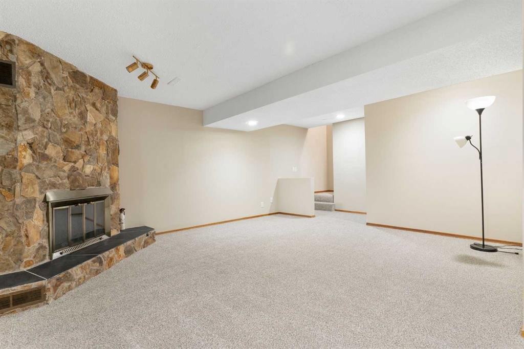 123 Glacier Drive Sw, Calgary, AB - Indoor With Fireplace
