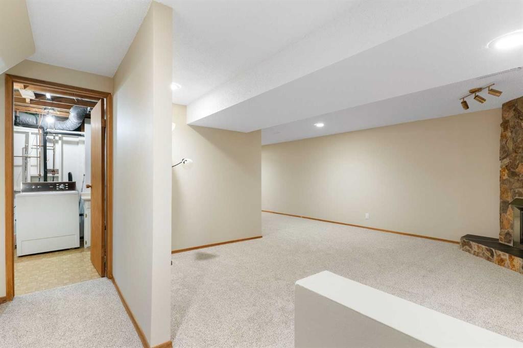 123 Glacier Drive Sw, Calgary, AB - Indoor Photo Showing Other Room
