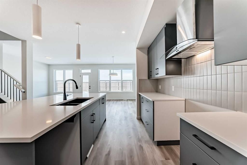 54 Bartlett Row Se, Calgary, AB - Indoor Photo Showing Kitchen With Double Sink With Upgraded Kitchen