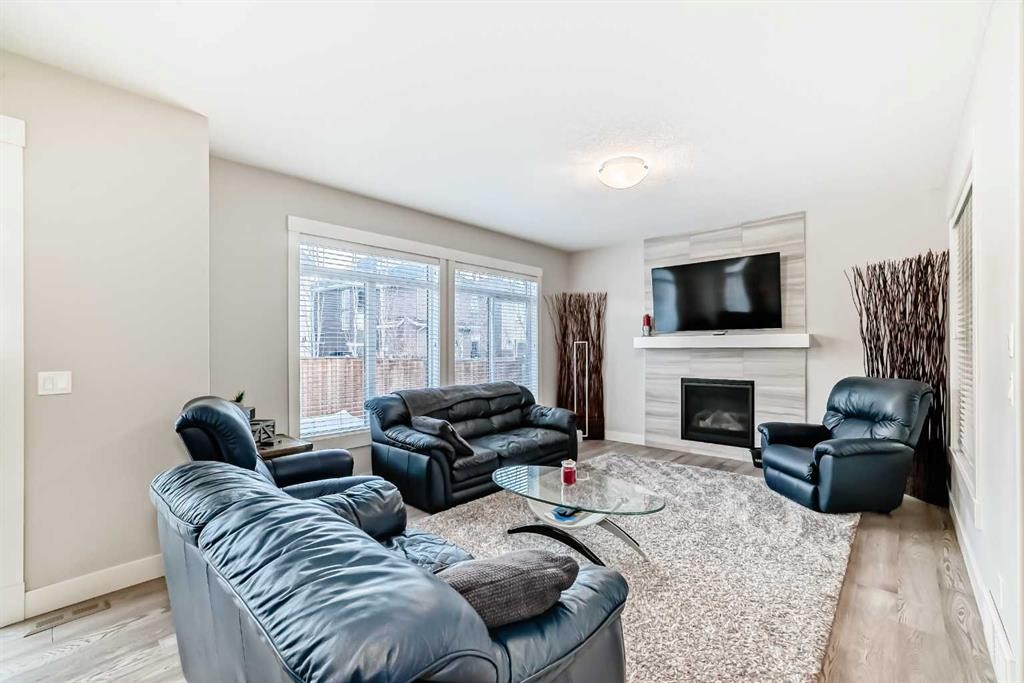 477 Legacy Boulevard Se, Calgary, AB - Indoor Photo Showing Living Room With Fireplace
