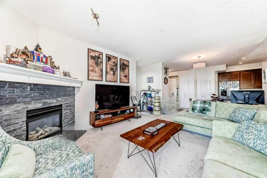210-1005A Westmount Drive, Strathmore, AB - Indoor Photo Showing Living Room With Fireplace