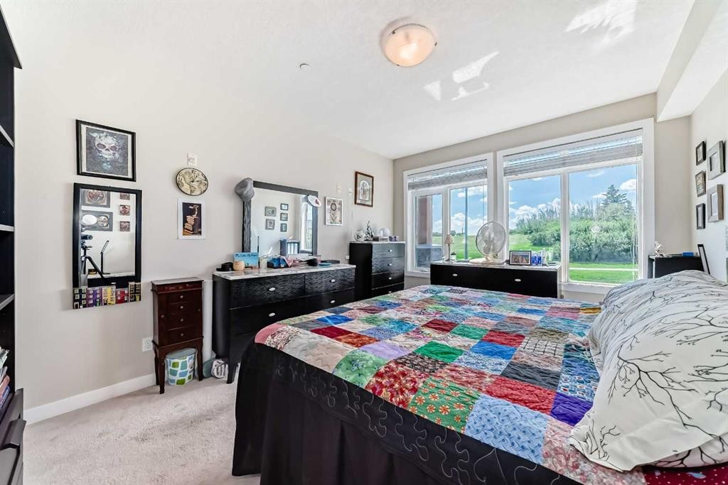 210-1005A Westmount Drive, Strathmore, AB - Indoor Photo Showing Bedroom