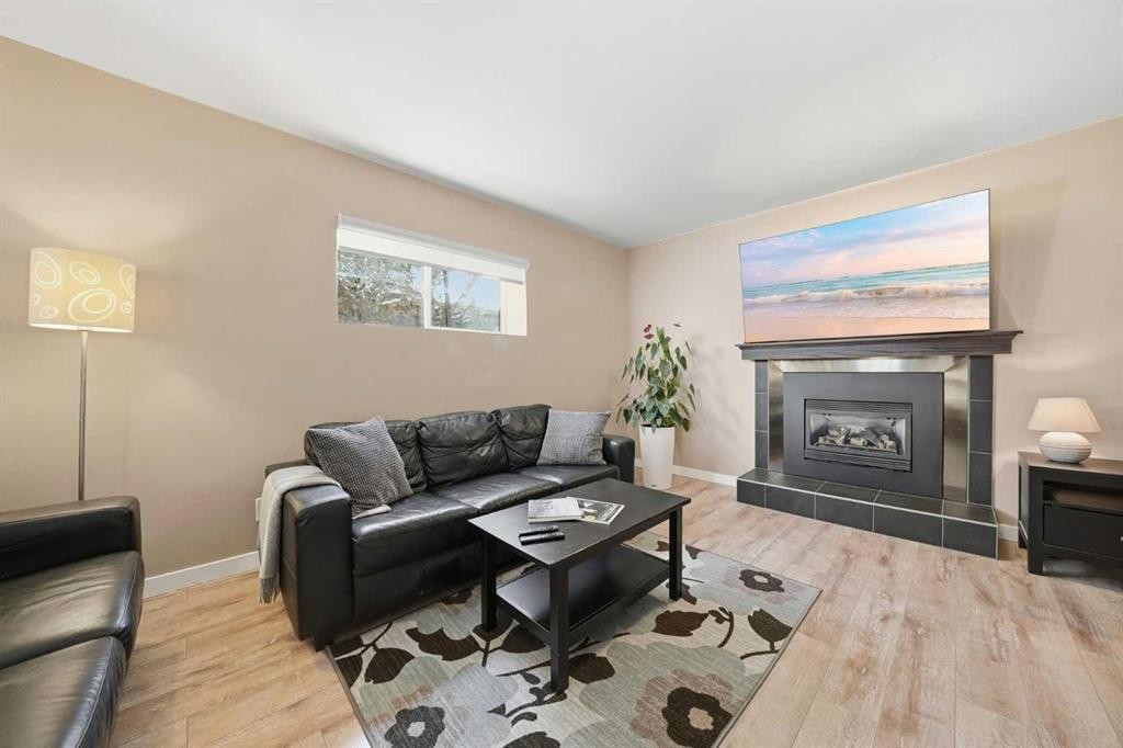 132 Shawcliffe Circle Sw, Calgary, AB - Indoor Photo Showing Living Room With Fireplace