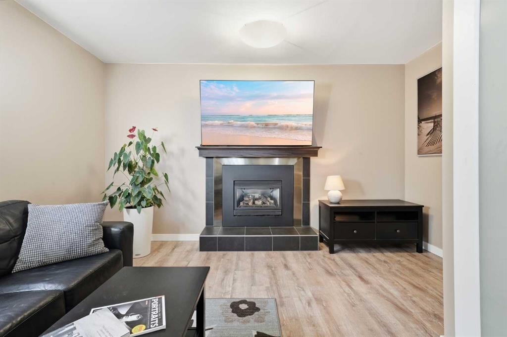 132 Shawcliffe Circle Sw, Calgary, AB - Indoor Photo Showing Living Room With Fireplace